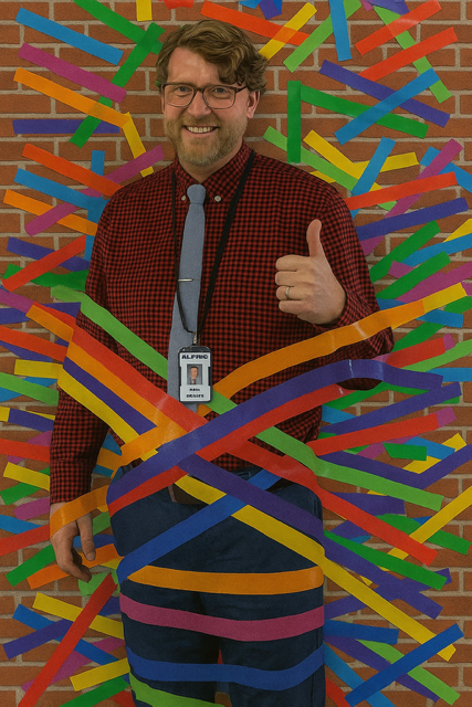 Mr. Killpack taped to a wall