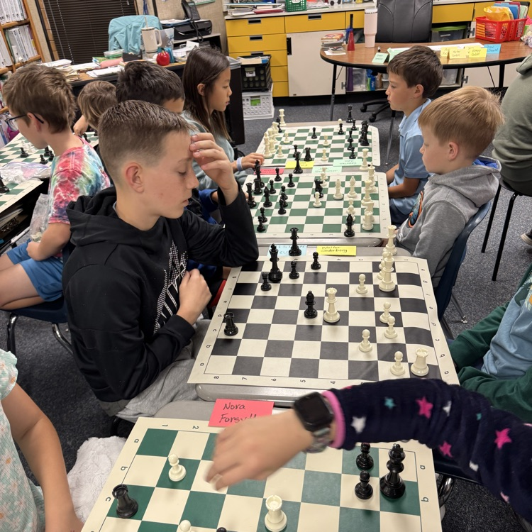 kids playing chess. 