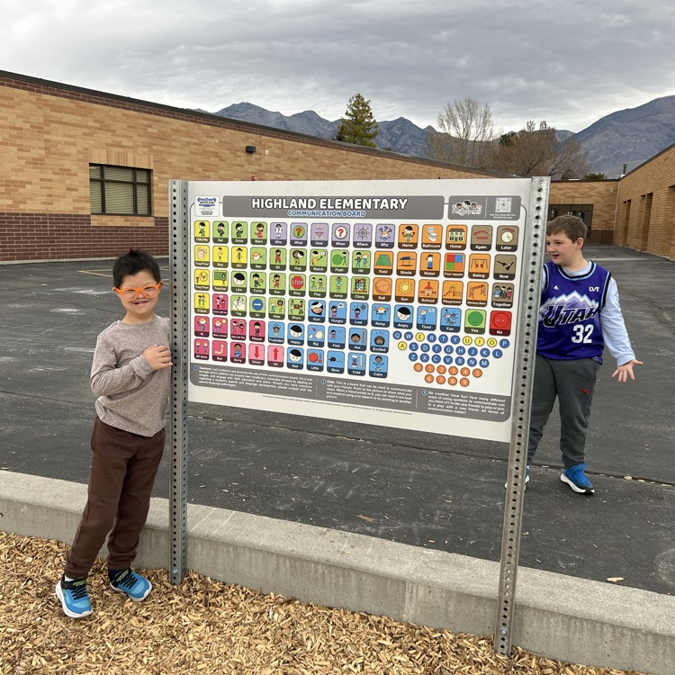 students interacting with the communication board 