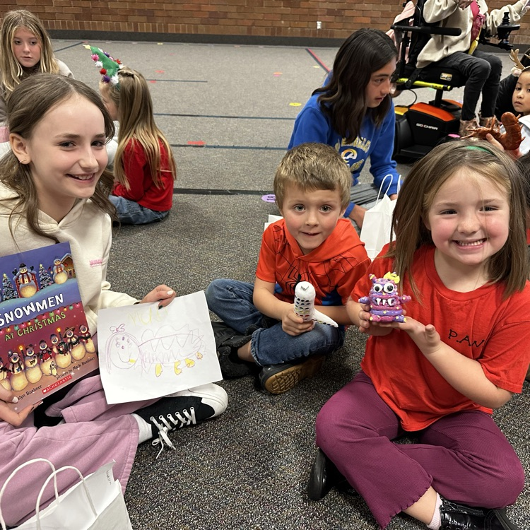 students sitting on the floor