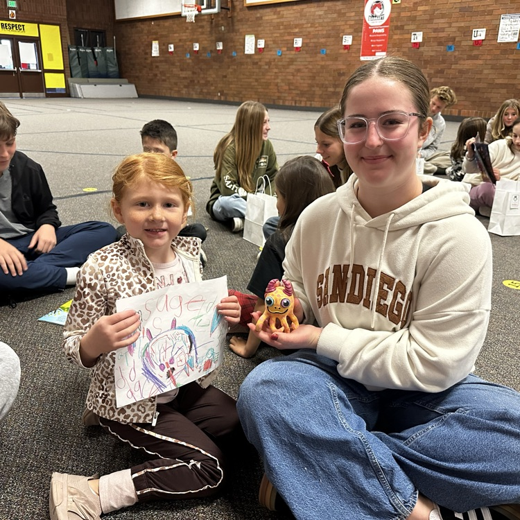students sitting on the floor