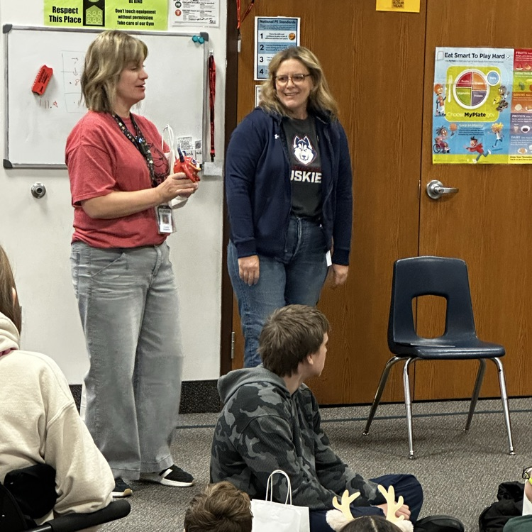 teachers standing in front of students