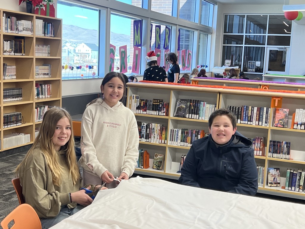 Students making a blanket. 