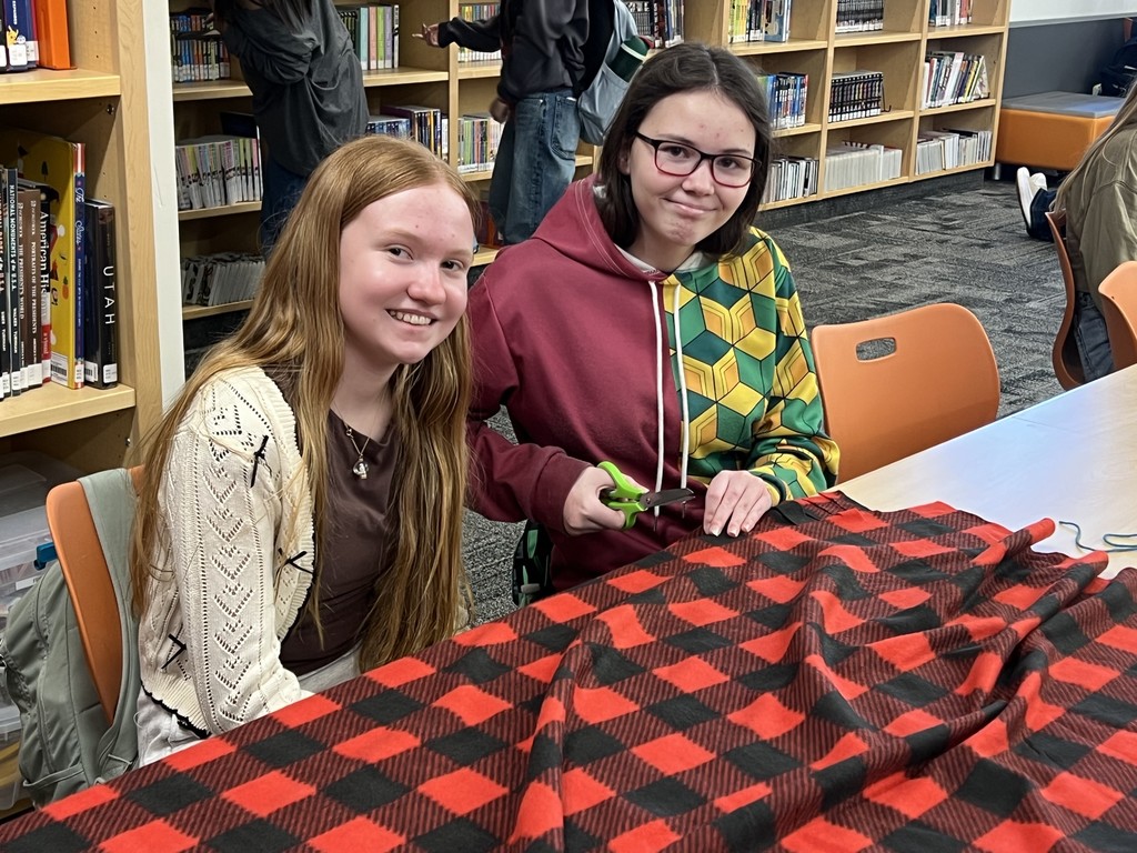 Students making a blanket. 