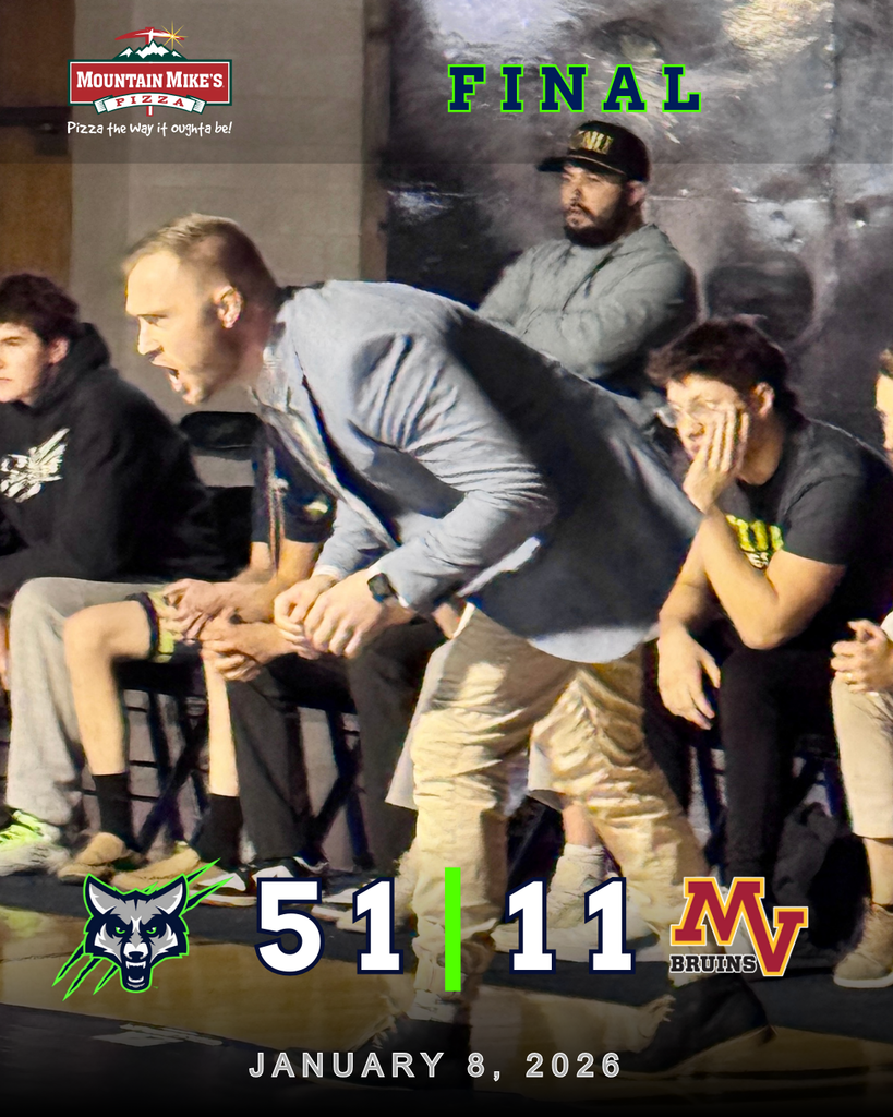 Wrestling coach stands and leans forward from the bench in an intense moment during a dual meet as wrestlers and staff sit behind him. A graphic overlay reads “FINAL” with the score showing Timpanogos 51 and Mountain View 11, dated January 8, 2026, with T-Wolves and Mountain View Bruins logos and a Mountain Mike’s Pizza sponsor logo in the corner.