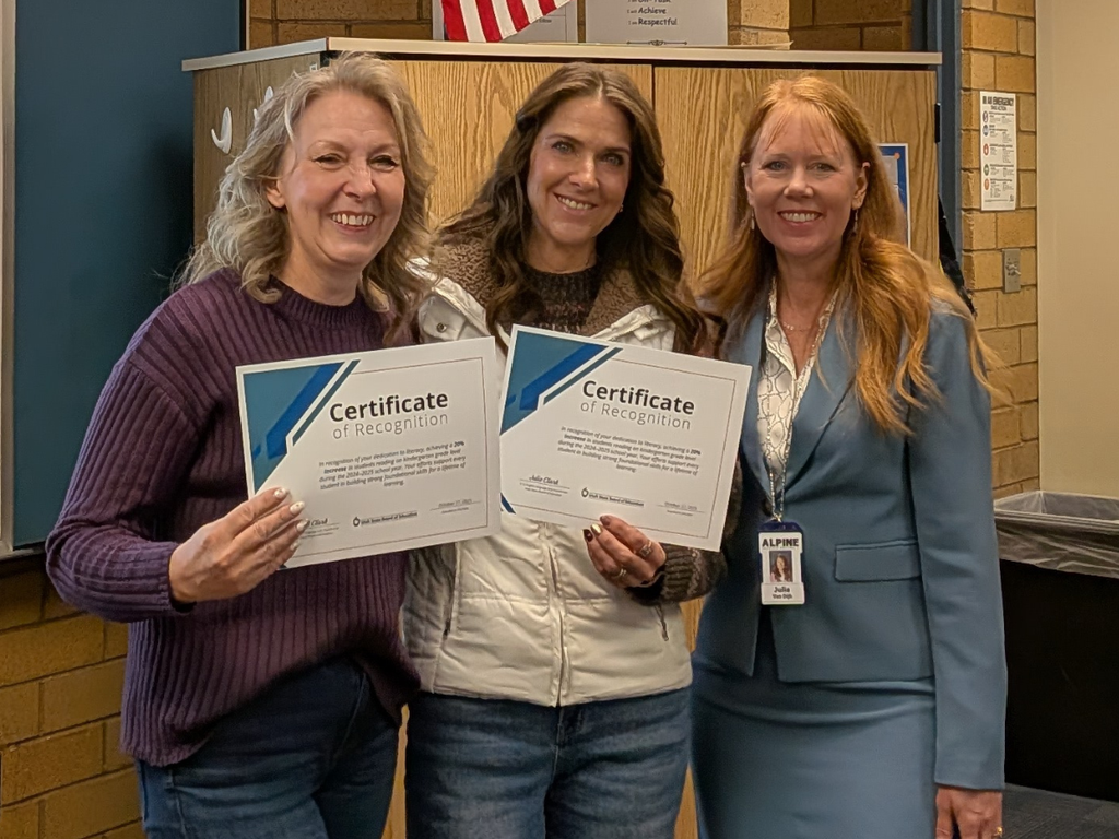 Mrs. van Dijk presents certificate to Kindergarten teachers, Mrs. Frye & Mrs. Brady