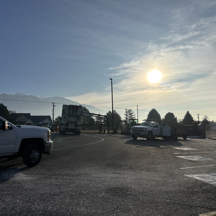 construction crews work to repair water line break