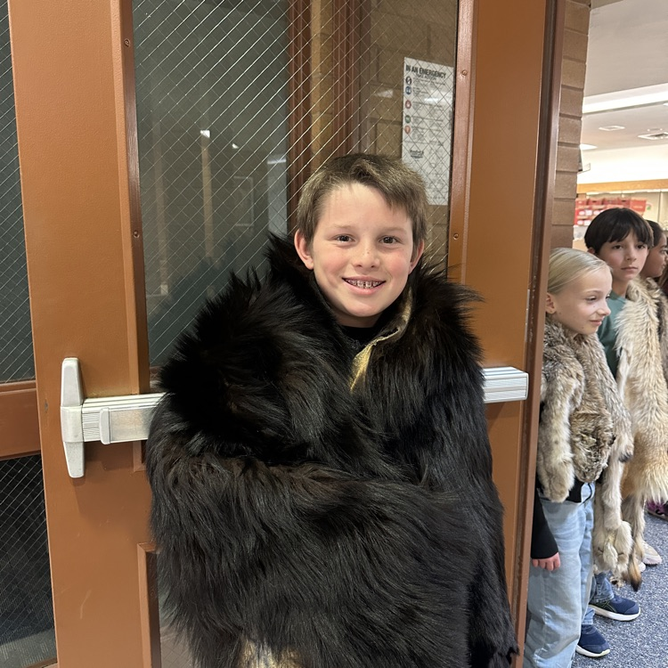 4th grader wearing trapper coat 