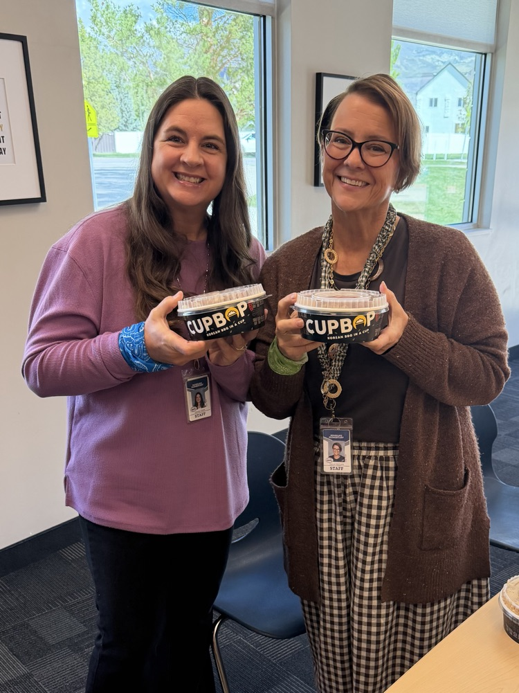 Mrs. Glade and Mrs. McGuire holding Cupbop