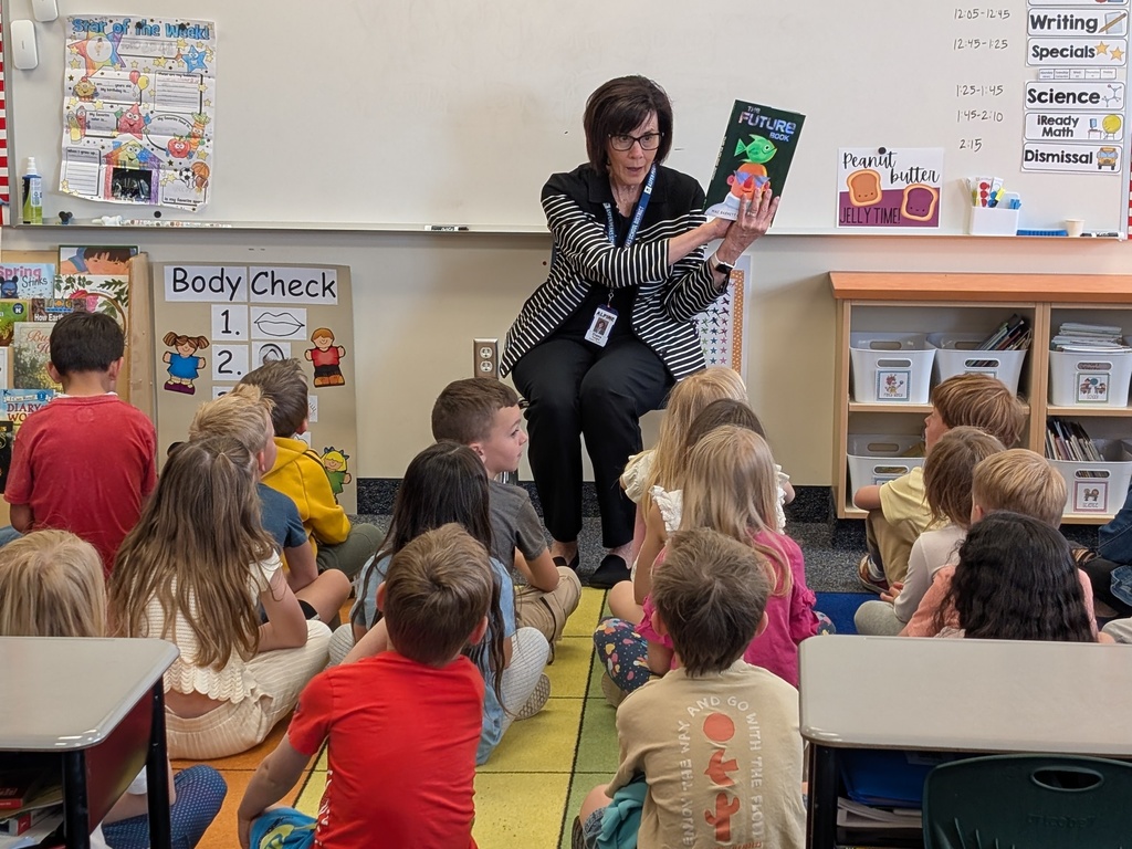 School board member reads to 1st grade students