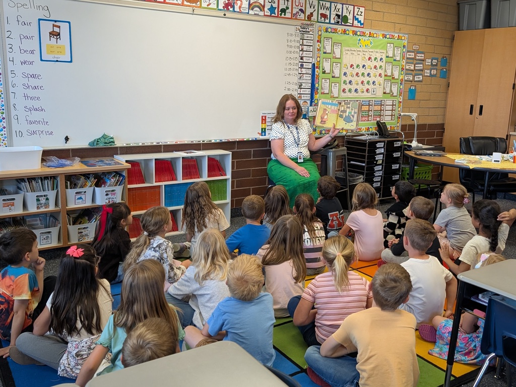 School board member reads to 1st grade students