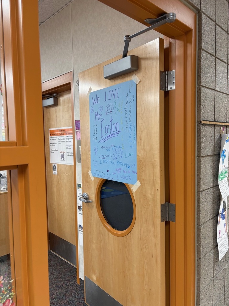 Door with sign that says we love Mrs. Easton, and her students signatures. 