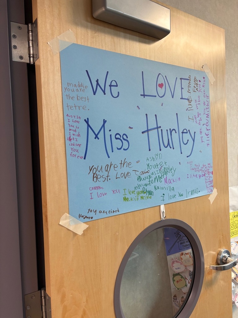 Door with sign that says, "We love Mrs. Hurley"  and her students signatures. 