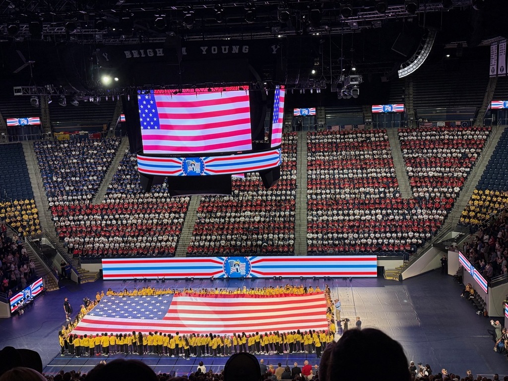 American Flag made from students and teachers from across the state with colored shirts. 