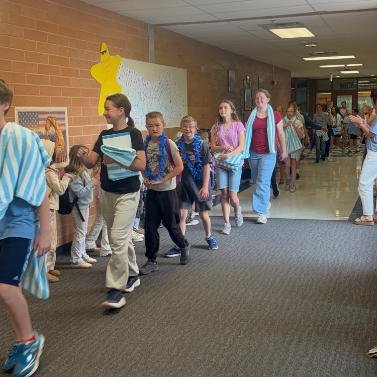 students walking in the halls at the last day clap out