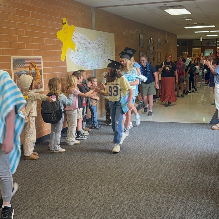 students walking in the halls at the last day clap out