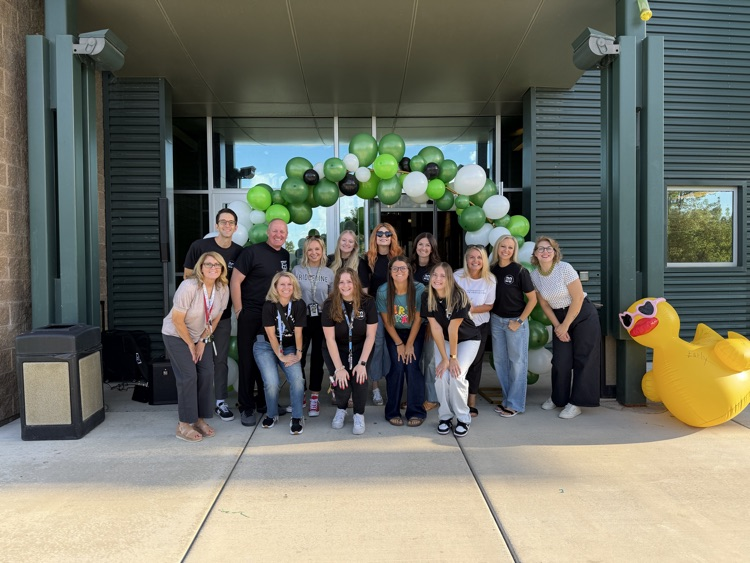 Ridgeline faculty and staff under a balloon arch
