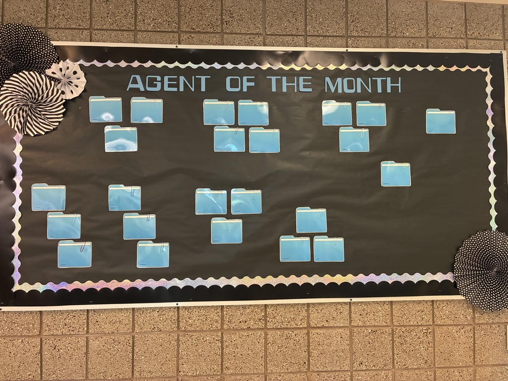 Image of a bulletin board labeled "Agent of the Month"