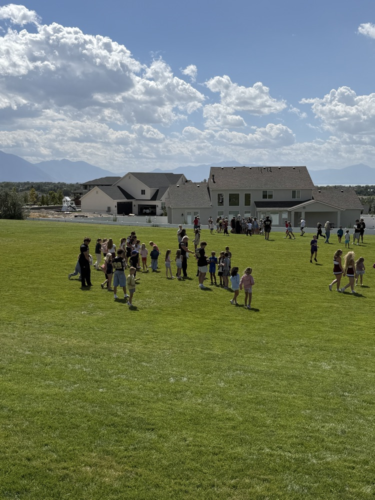 students on a grassy field