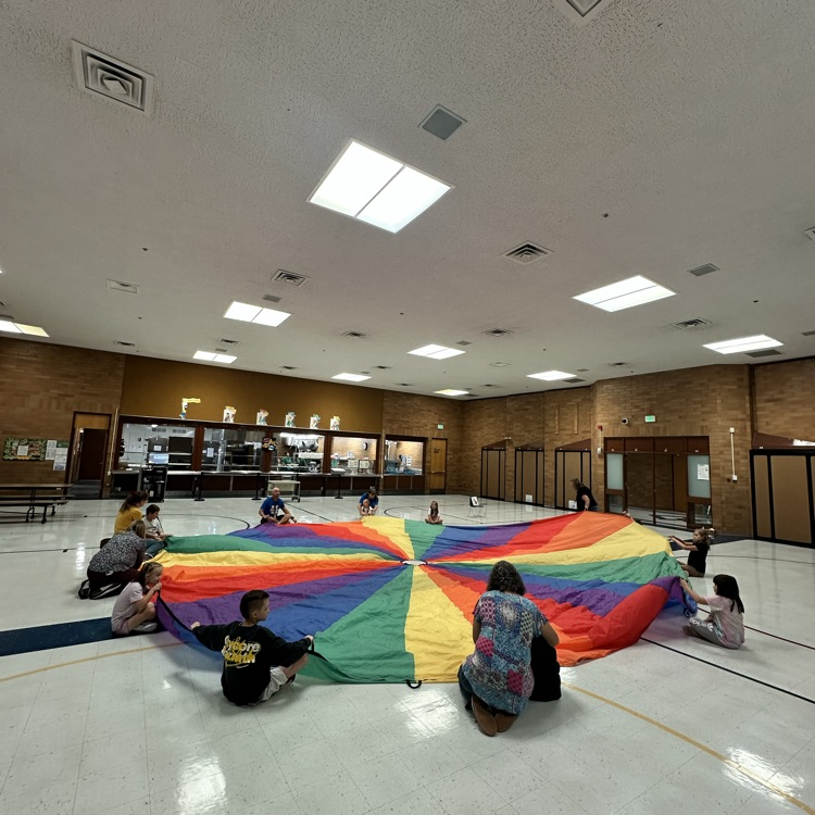 students with parachute at PE