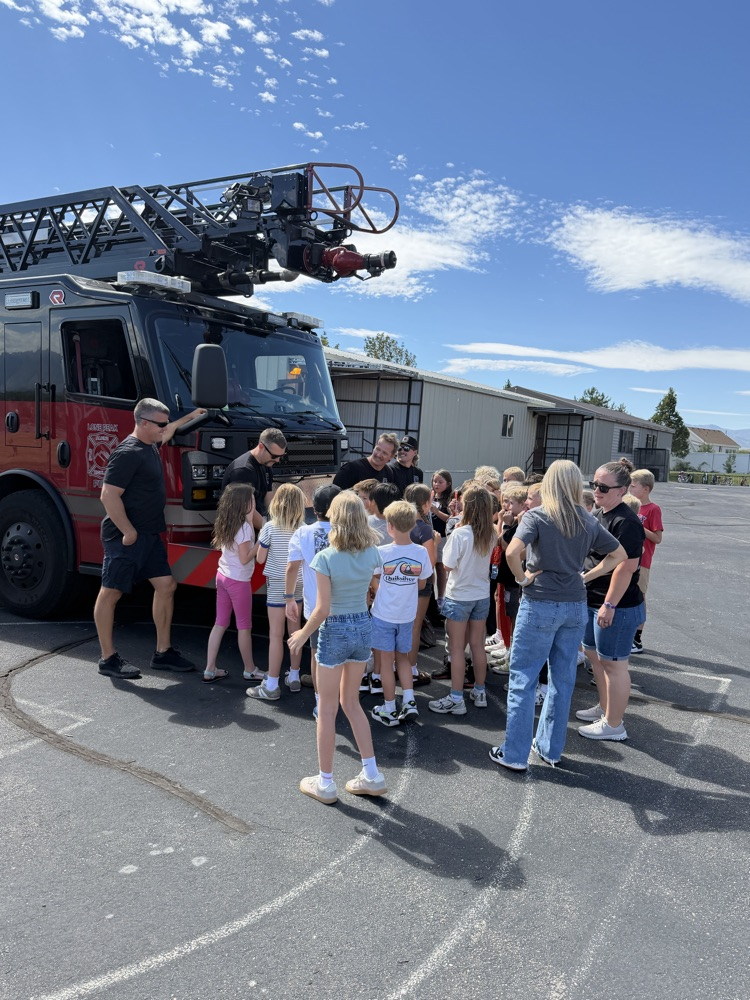 students checking out a fire truck