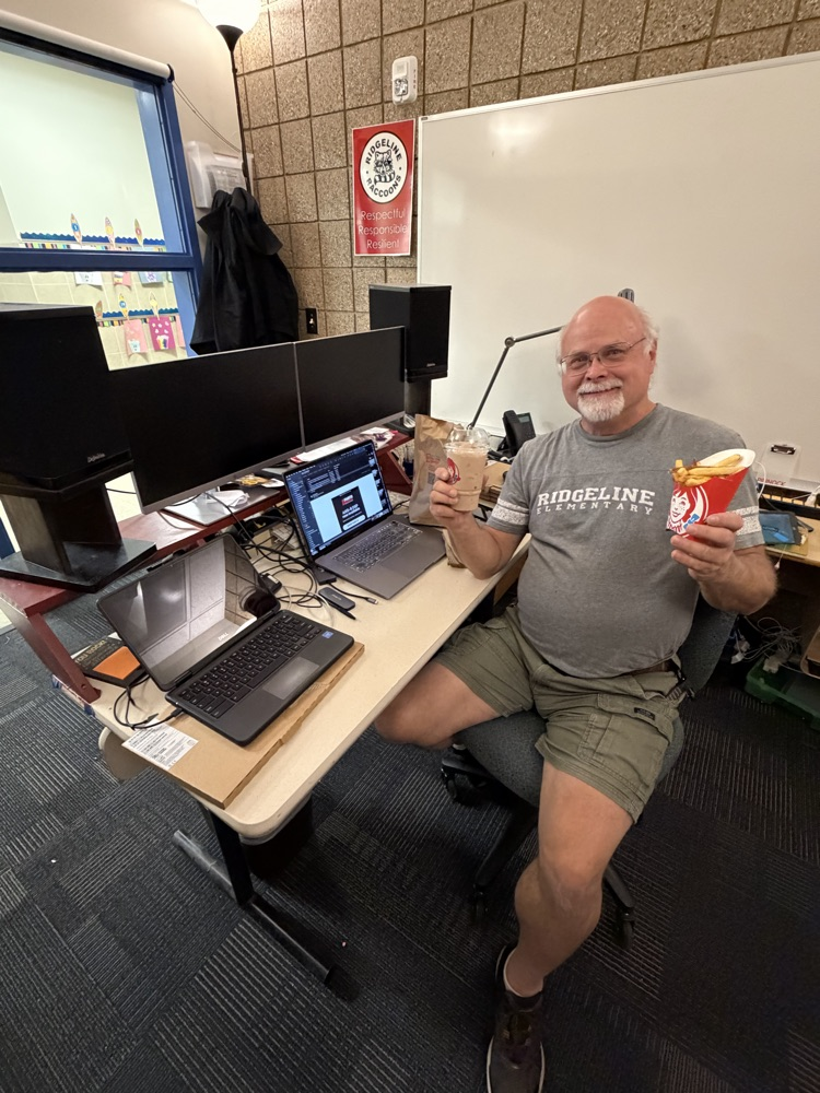 Mr. Pinnock holding up Wendy’s lunch
