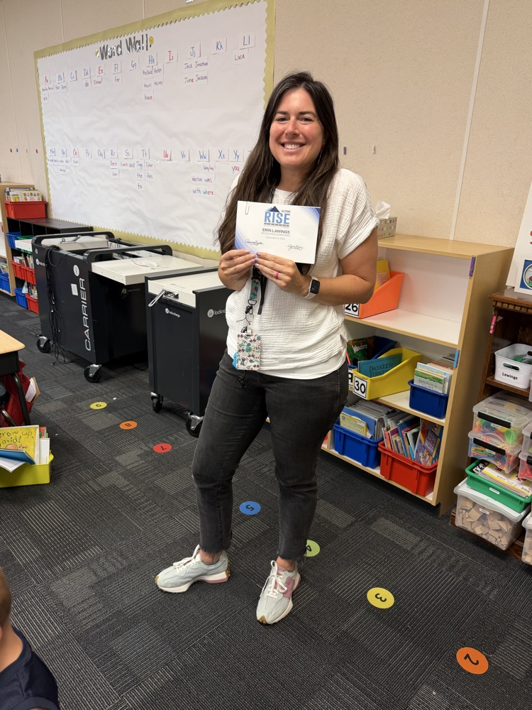Mrs. Lawings holding a Rise Certificate