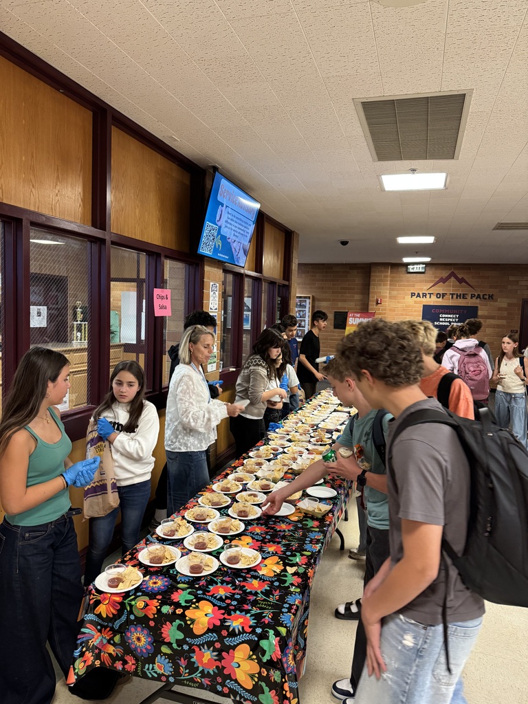Student in commons around a table