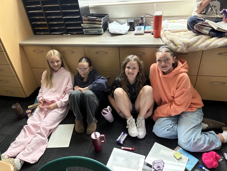 students reading on the floor