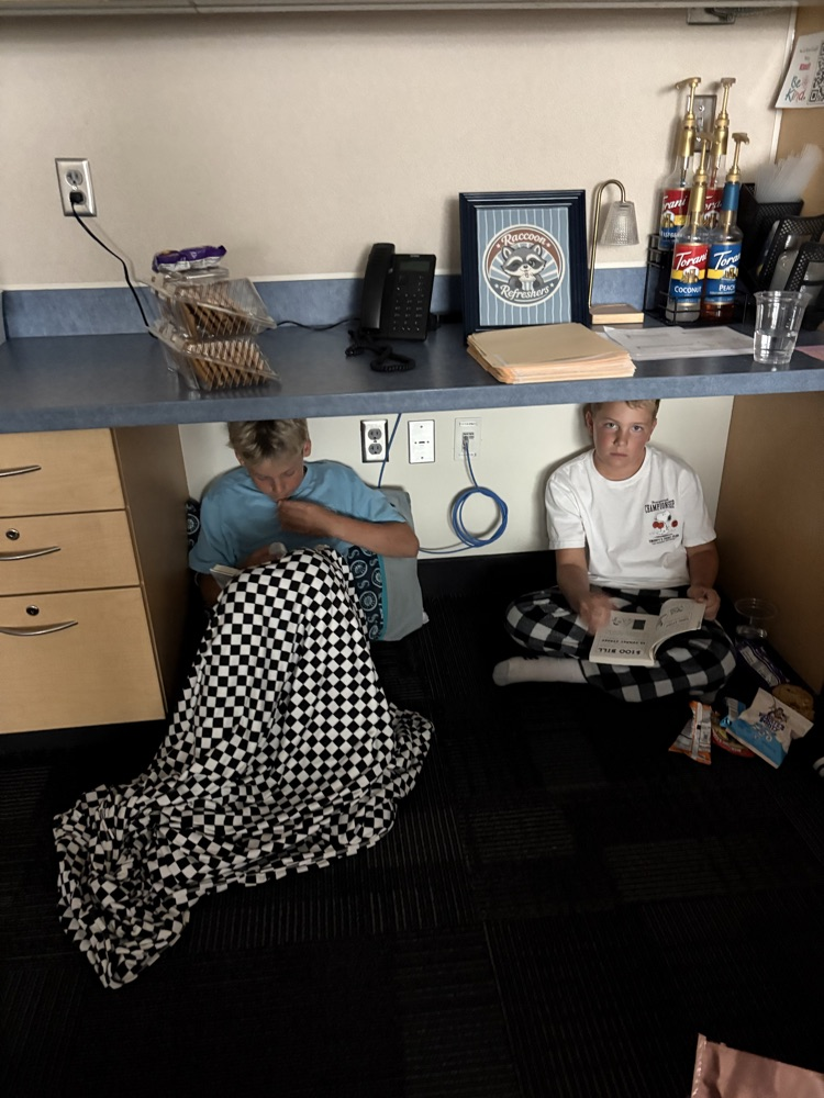 students reading under a counter