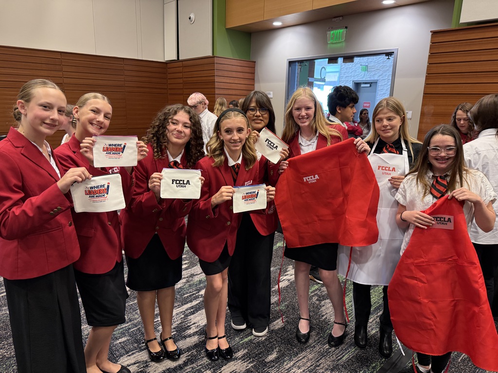 students wearing red jackets and ties