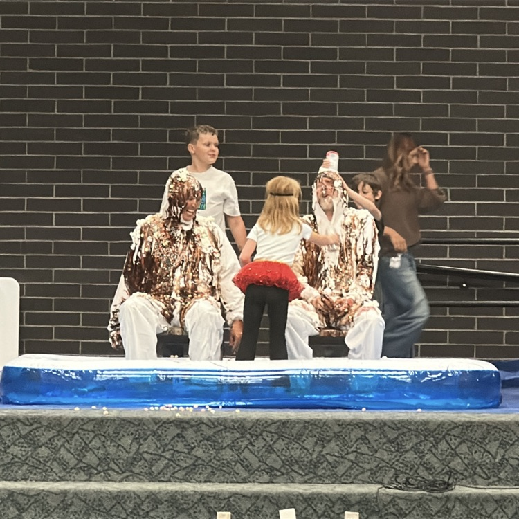 mr. Killpack and Mr. Campbell being made into human Sundaes