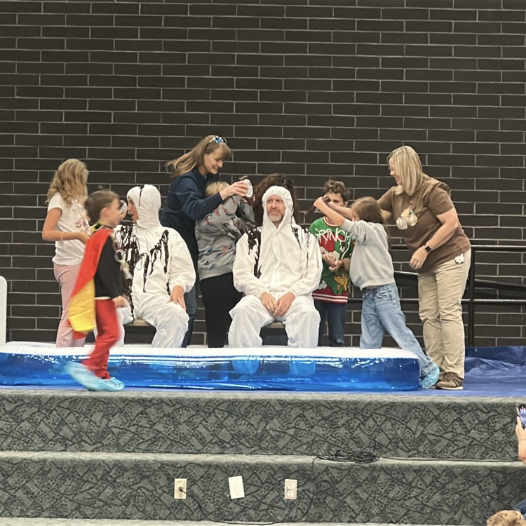 mr. Killpack and Mr. Campbell being made into human Sundaes