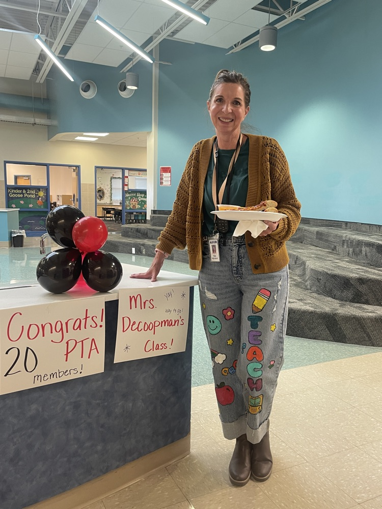 teacher holding a pizza by Congrats 20 members signs
