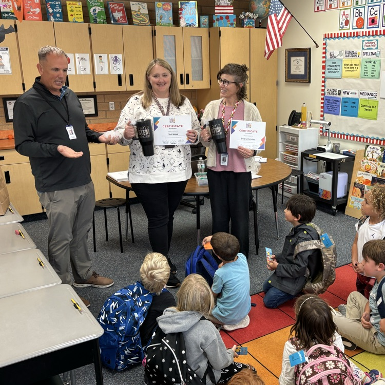 Mr. Campbell presenting STEM award to Mrs. Webb and Mrs. Christley  
