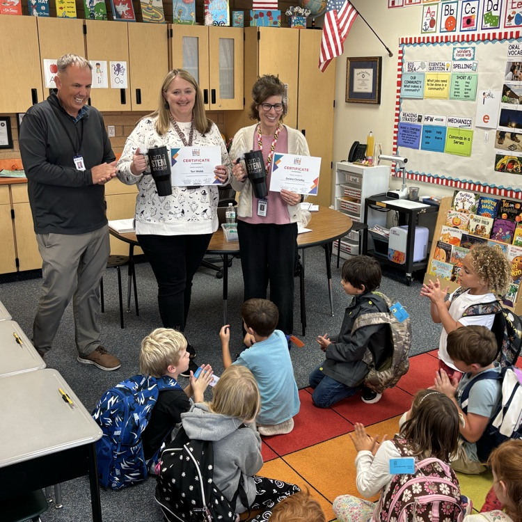 Mr. Campbell presenting STEM award to Mrs. Webb and Mrs. Christley