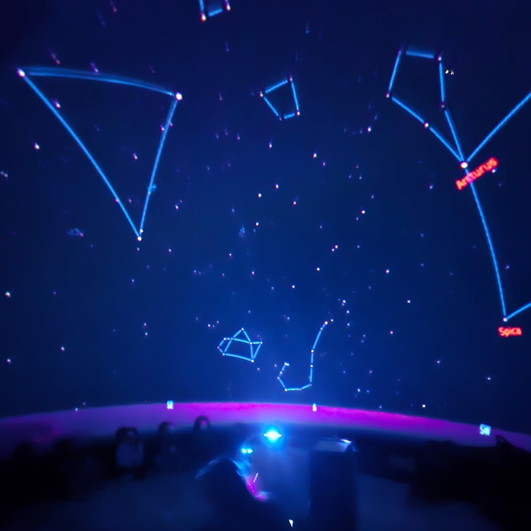 students learning in the star dome