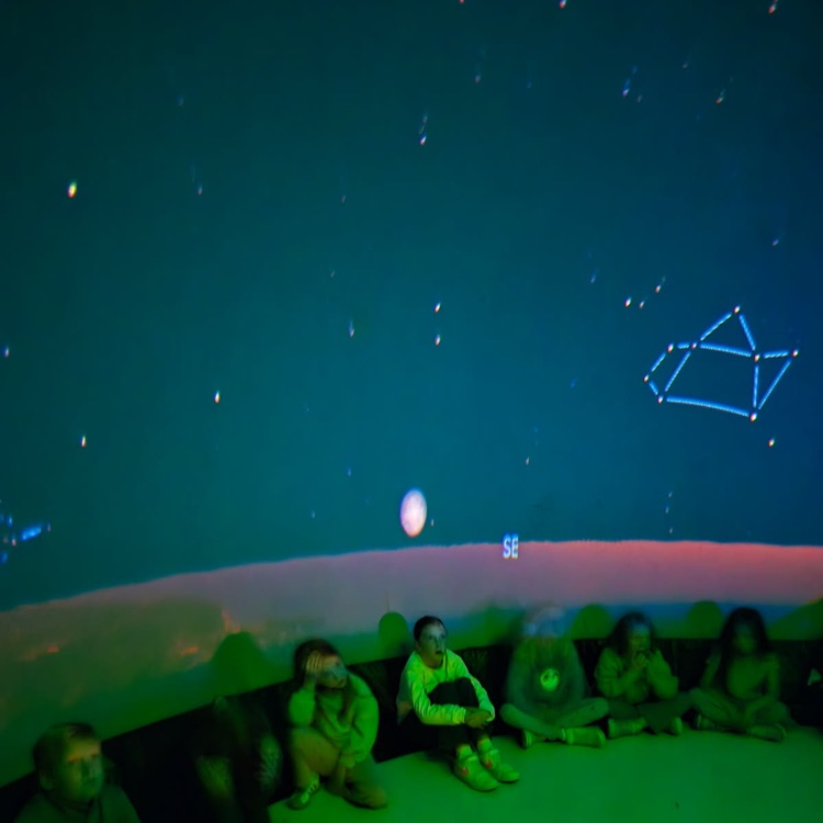 students learning in the star dome
