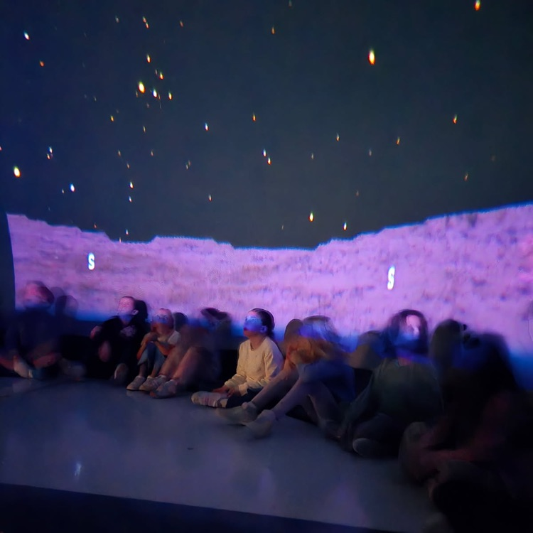 students learning in the star dome