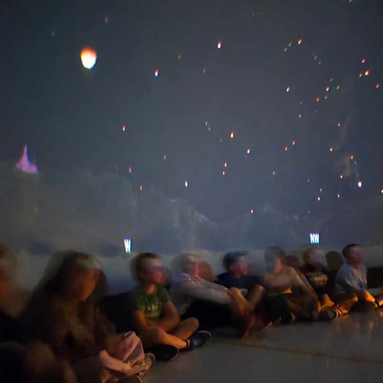 students learning in the star dome