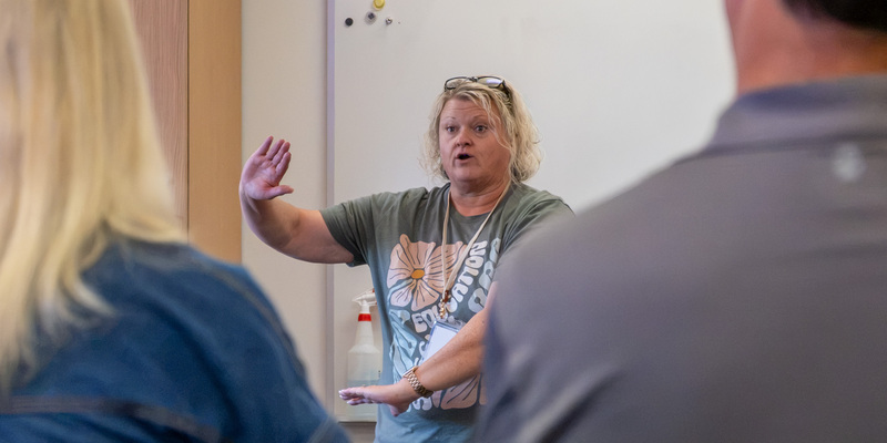 Participants watch as a Safety-Care training instructor instructs them on a Safety-Care technique