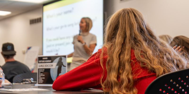 Noelle Pikus-Pace presenting in front of classroom of student-athletes at Captains Academy