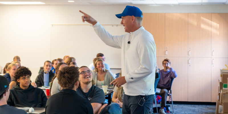 Travis Hansen presenting in front of classroom of student-athletes at Captains Academy