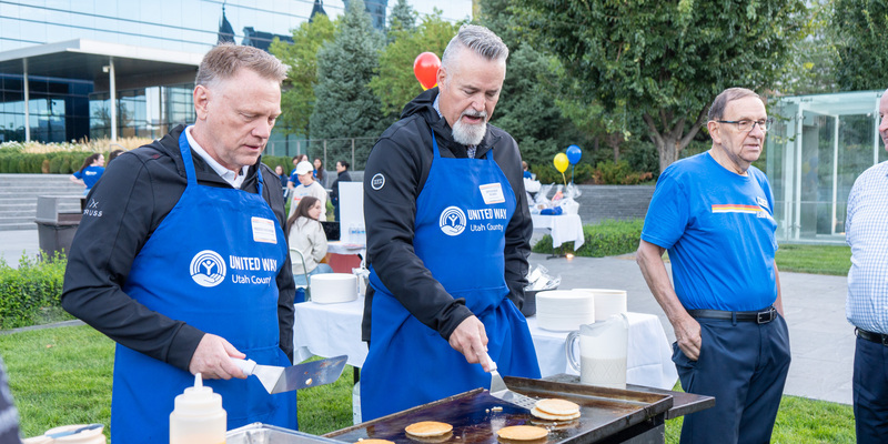 Superintendant Rob Smith flipping pancakes at United Way Day of Caring event