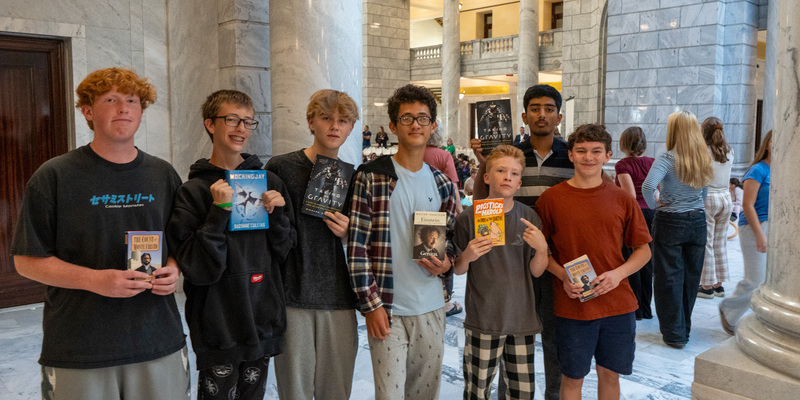 7 Willowcreek JH students stand in the Utah State Capitol holding books
