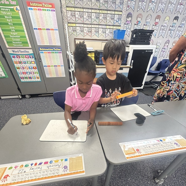 students using whiteboards