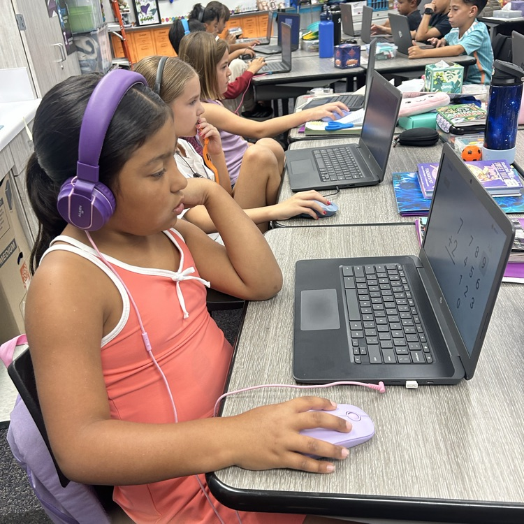 students using their Chromebook for AR instruction
