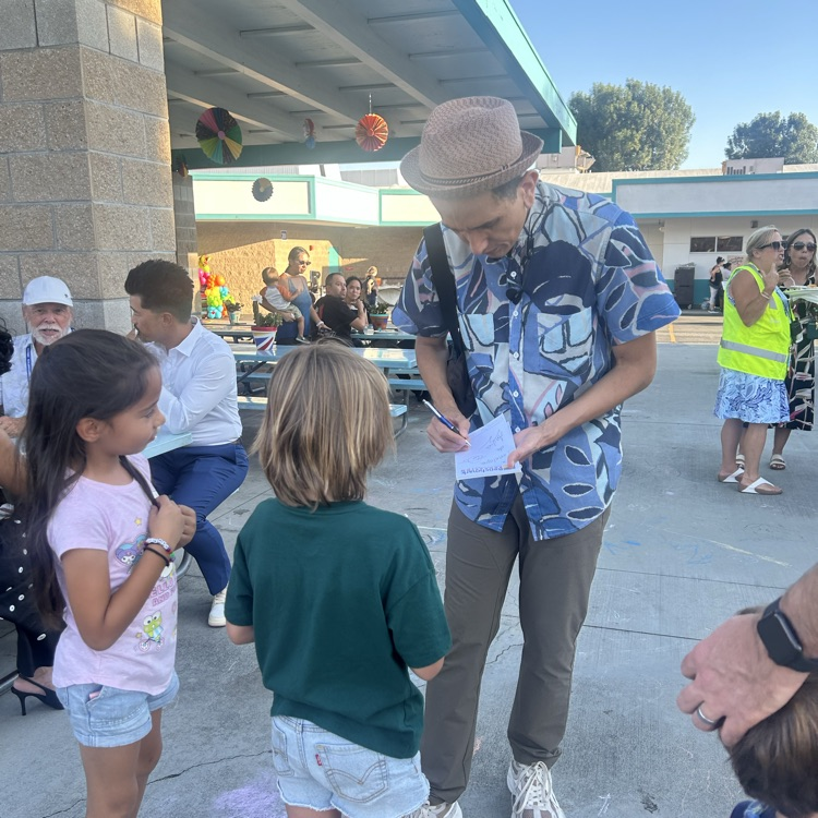 singer giving autographs
