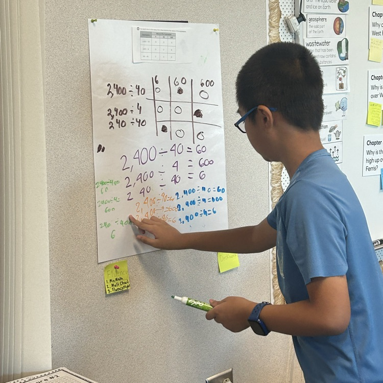 student using vertical surfaces to learn math