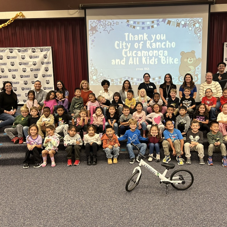 kindergarten students and Rancho CITY officials posing in a group picture at the bike reveal